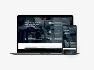 QTS website displayed in laptop and iPhone