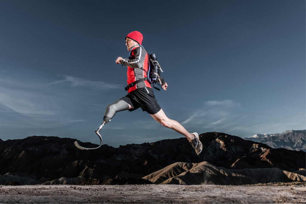 Man with prosthetic leg running